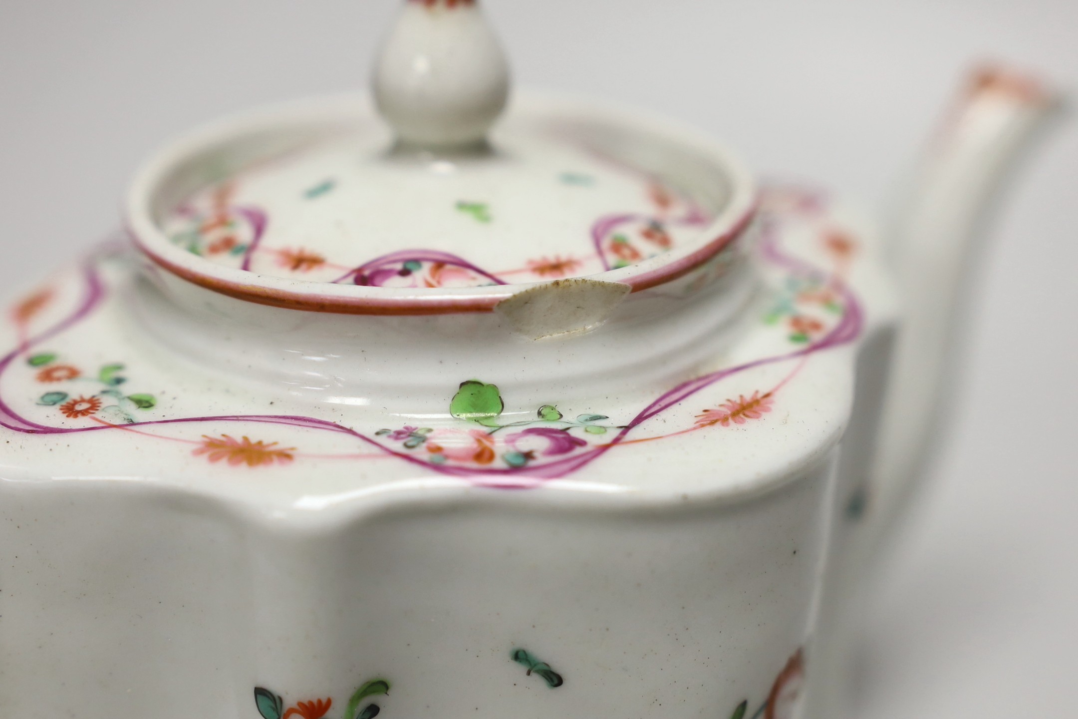A late 18th century painted Newhall teapot and cover. 14.5cm high